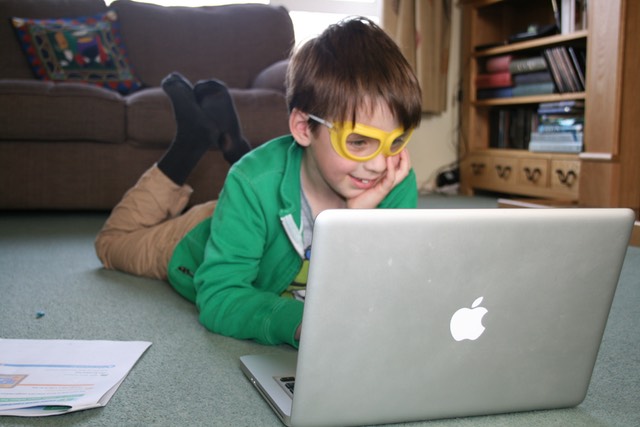 Child playing on a laptop